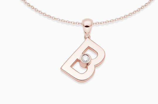 This sleek letter pendant has a sliding diamond that moves and catches the light.   Chain: This pendant comes with an 18kt rose gold chain, the length of the chain is 16 inches. Available on FalenaFineJewelry.com or in-store