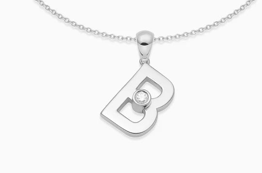 This sleek letter pendant has a sliding diamond that moves and catches the light.   Chain: This pendant comes with an 18kt white gold chain, the length of the chain is 16 inches. Available on FalenaFineJewelry.com or in-store
