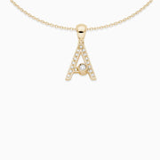 This sleek diamond pave letter pendant has a moving diamond accent that slides from side to side. This pendant comes with an 18kt yellow gold chain, the length of the chain is 16 inches. Available on FalenaFineJewelry.com or in-store
