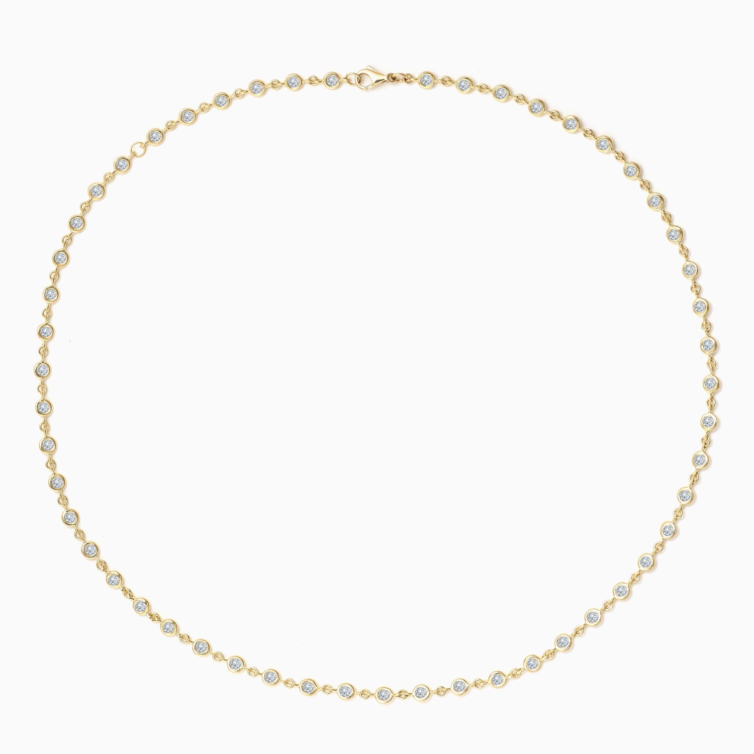 This elegant Essential Bezel Tennis Necklace boasts a timeless design with its bezel set diamonds. Shop now on falenafinejewelry.com or in-store